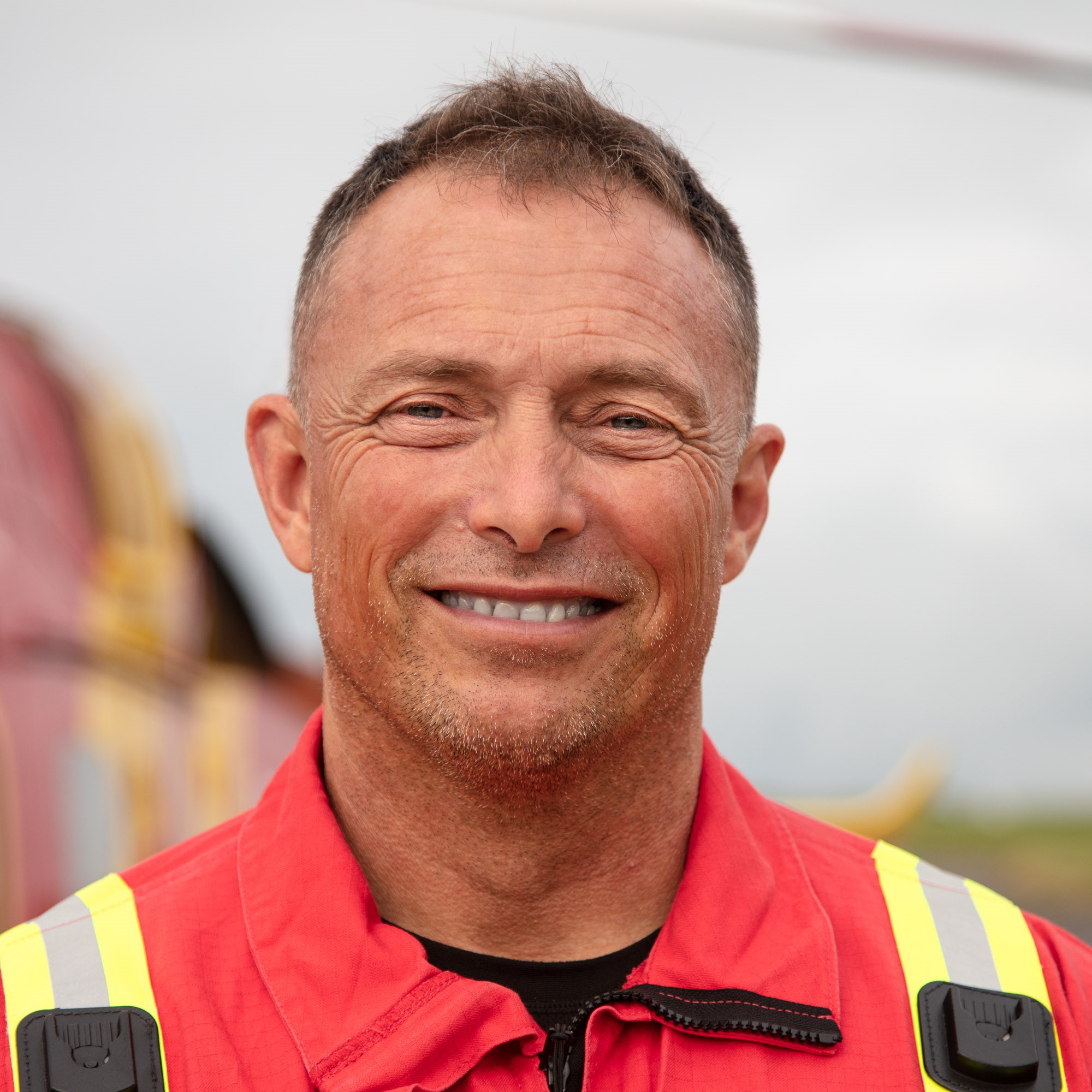 Man smiling in uniform